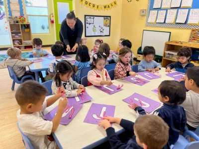 3-year-old children in Village Preschool Academy's Junior Pre-K program playing with clay in a hands-on creative learning activity